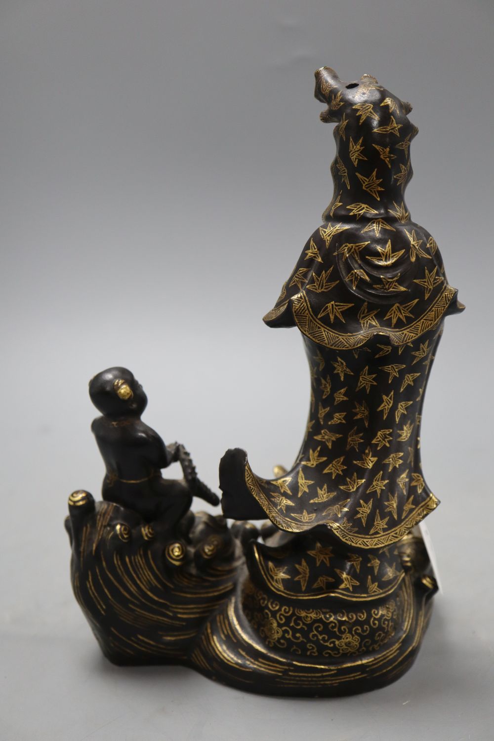 A Japanese Kutani Kwannon group, height 24cm